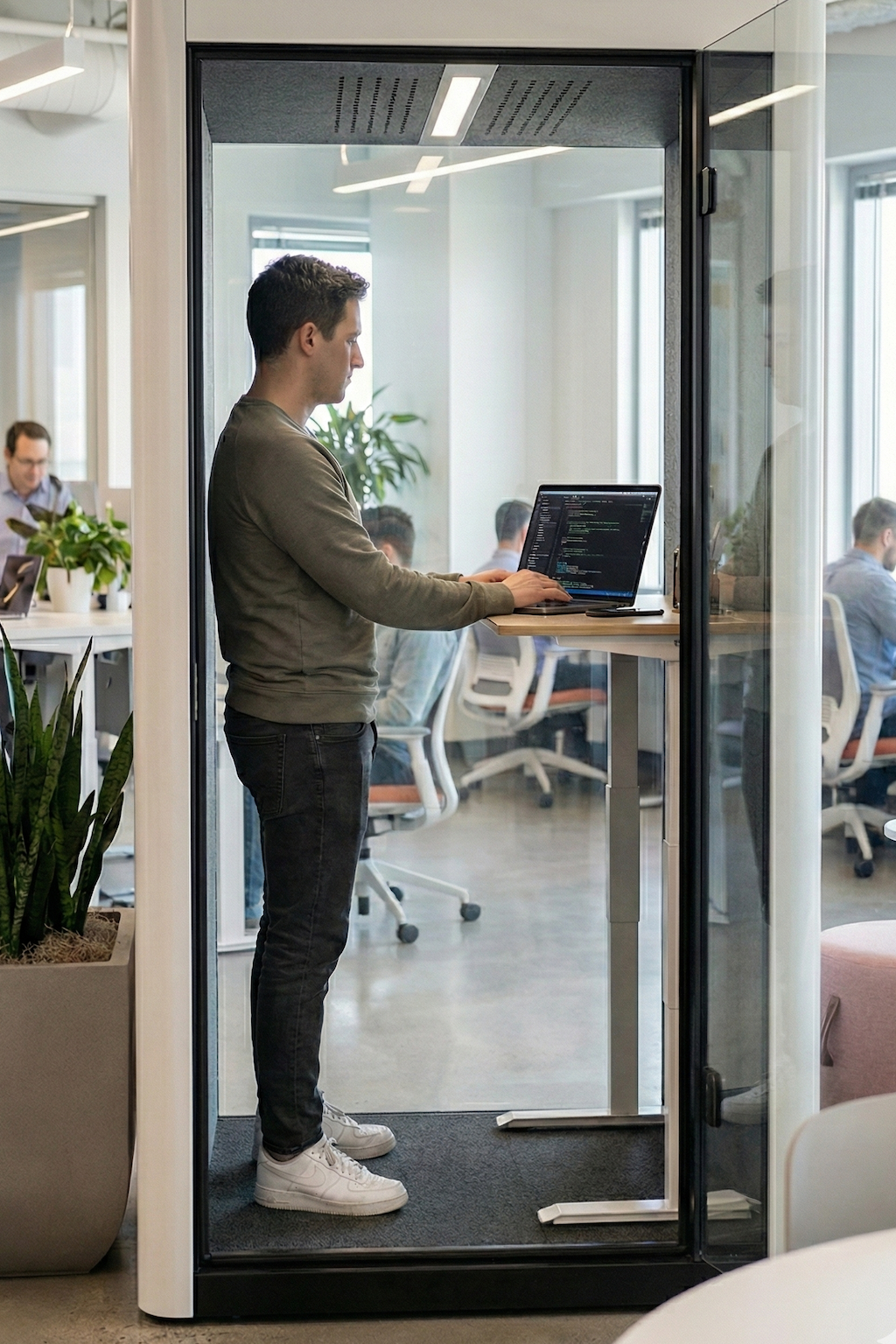 a men works in private booth